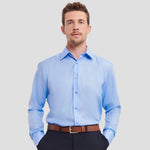 Model wearing the Russell Collection Long Sleeve Tailored Ultimate Non-Iron Shirt 958M in Bright Sky