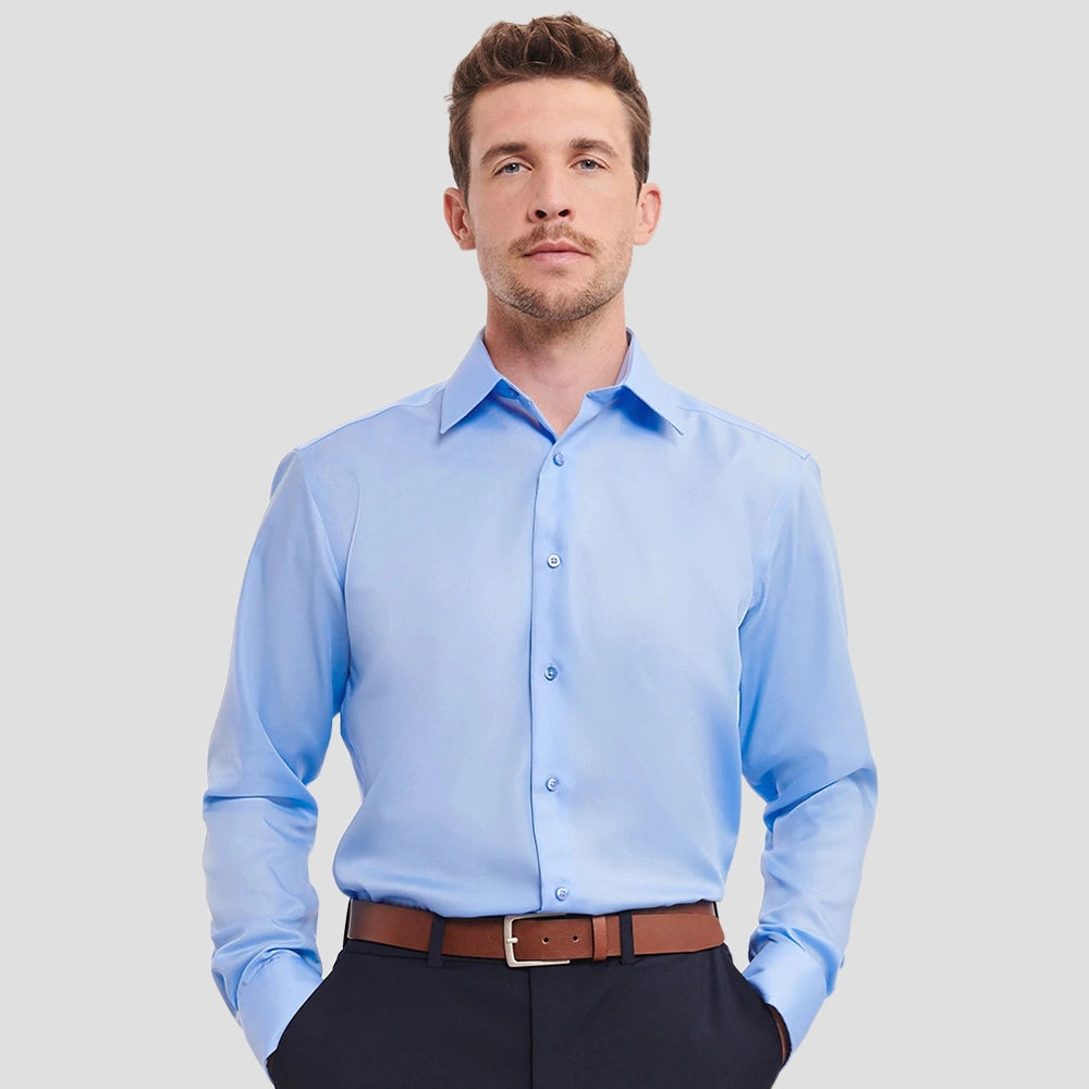 Model wearing the Russell Collection Long Sleeve Tailored Ultimate Non-Iron Shirt 958M in Bright Sky