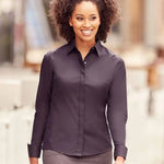 Model wearing the Russell Collection Ladies Ultimate Stretch Shirt in Black