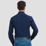 Model wearing the Russell Collection Long Sleeve Ultimate Stretch Shirt 960M in Bright Navy