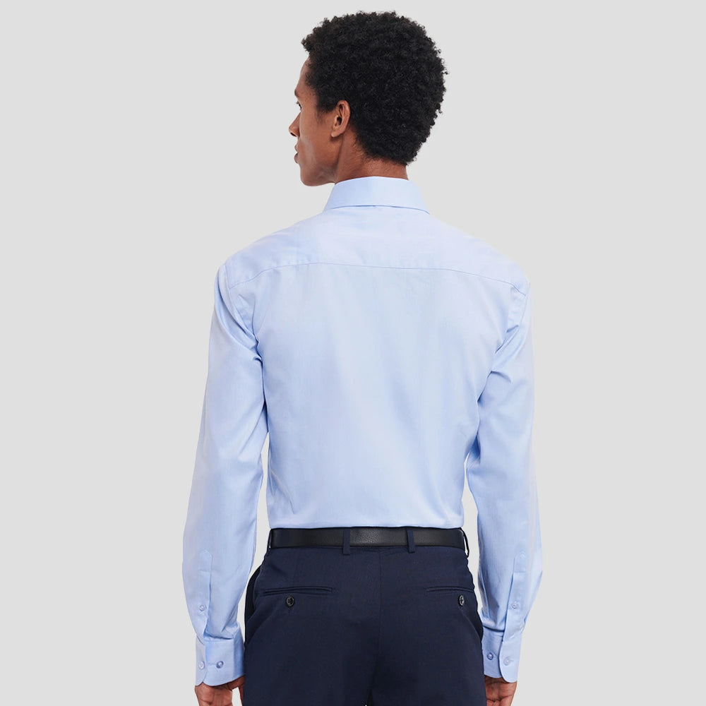 Rear view of Model wearing the Russell Collection Long Sleeve Herringbone Shirt 962M in Light Blue