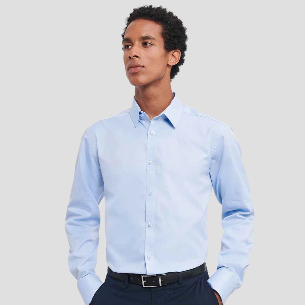Model wearing the Russell Collection Long Sleeve Herringbone Shirt 962M in Light Blue