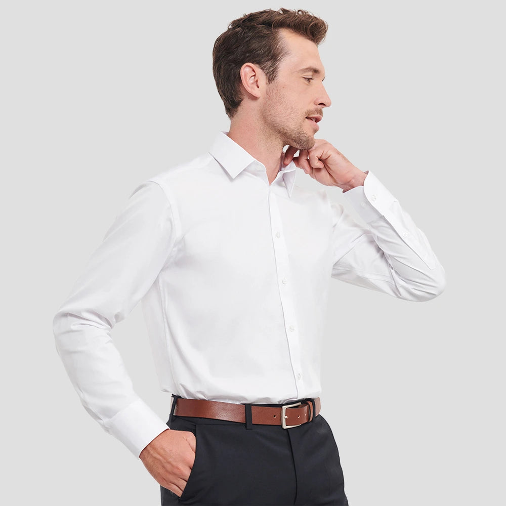 Side view of Model wearing the Model wearing the Russell Collection Long Sleeve Herringbone Shirt 962M in White