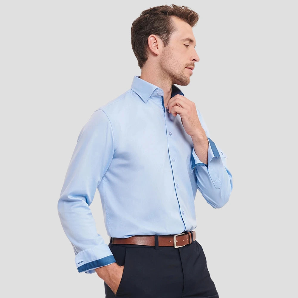 Model wearing the Russell Collection Long Sleeve Contrast Herringbone Shirt 946M in Light Blue / Mid Blue