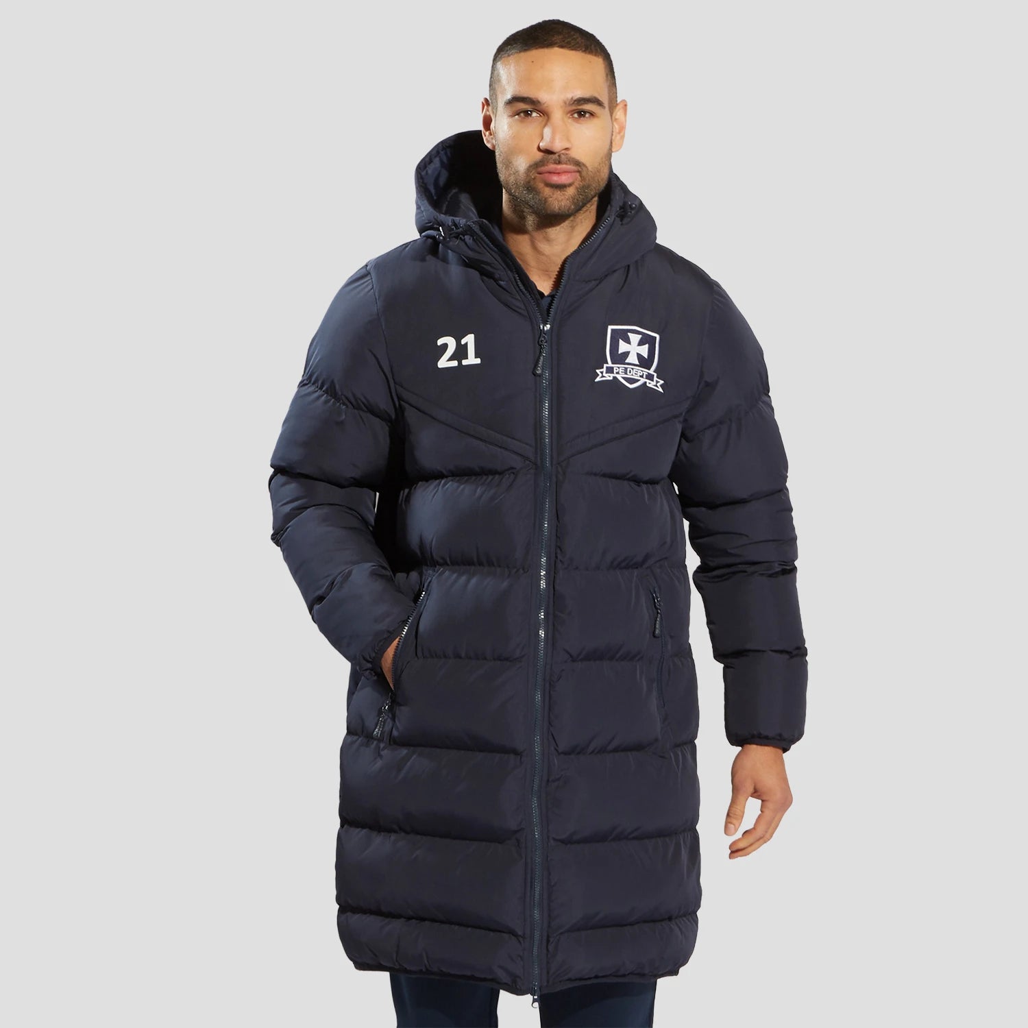 Model wearing the The Chadwick Chevron Puffer Coat in Navy.