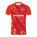 Red T20 cricket shirt with blue and yellow patterns and a visible sponsor logo