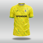 Yellow custom T20 cricket shirt with a pattern and 'SPONSOR' text