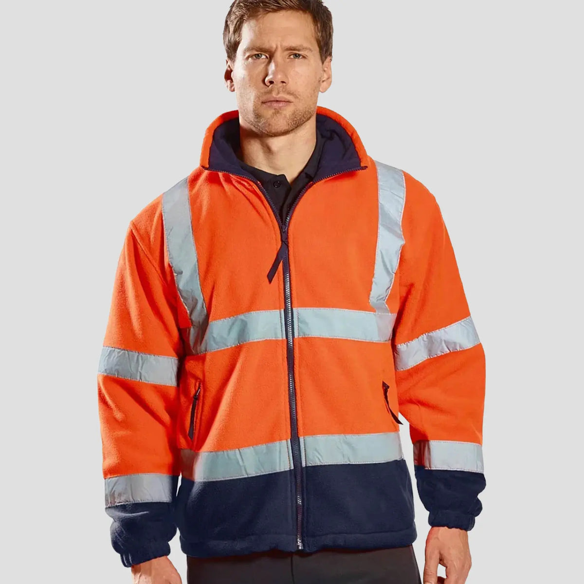 Model wearing the Hi-Vis Contrast Fleece F301 in Orange/Navy.