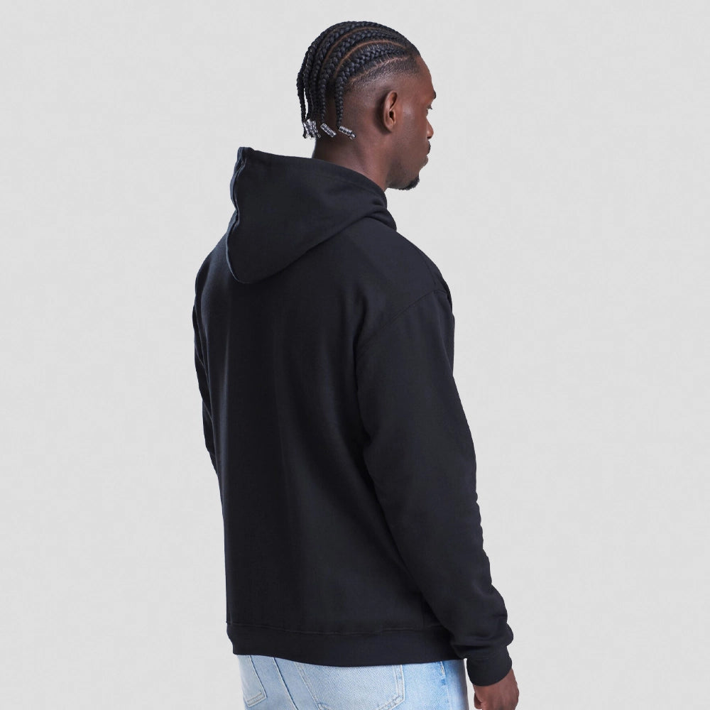 Person wearing a black AWDIS Just Hoods JH001 College Hoodie from the back on a light gray background