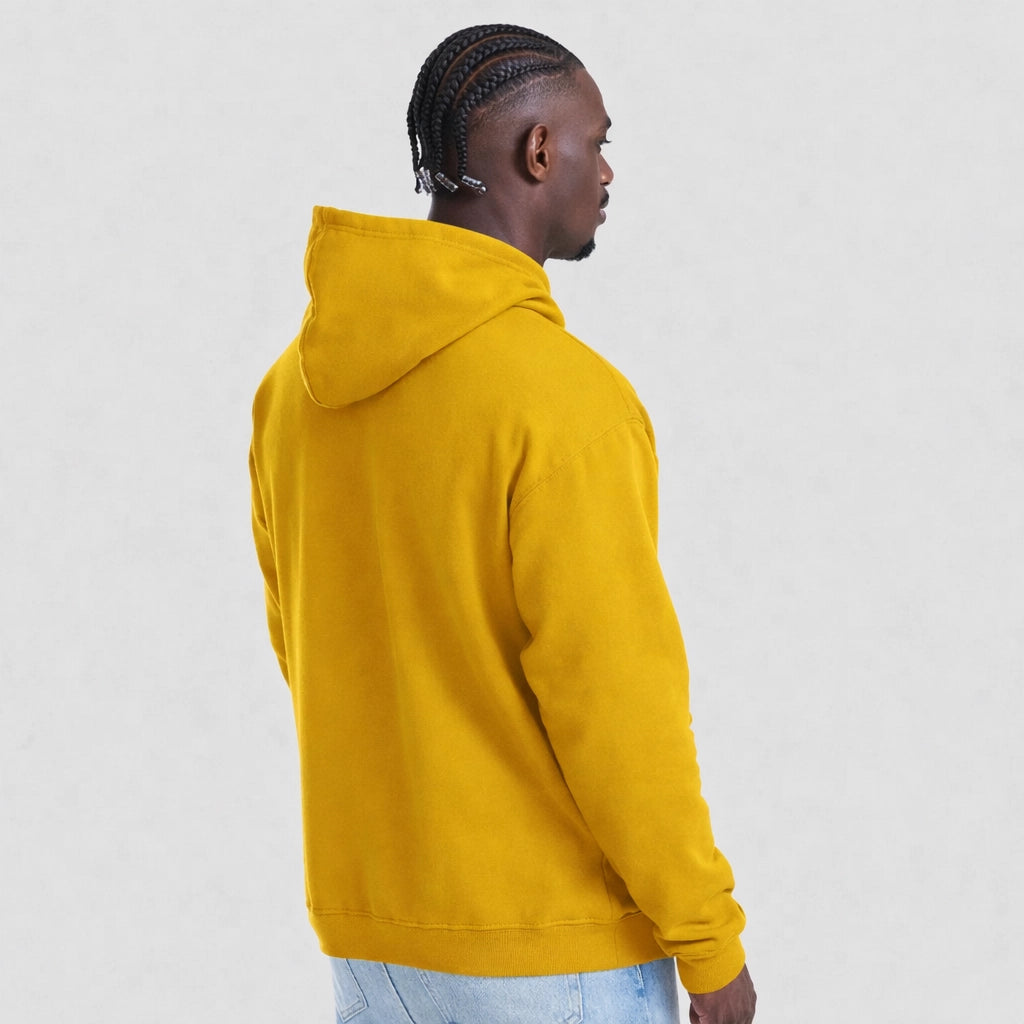 Person wearing a mustard AWDis JH001 College Hoodie