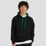 Model wearing the AWDis Varsity Hoodie JH003 in Jet Black / Kelly Green