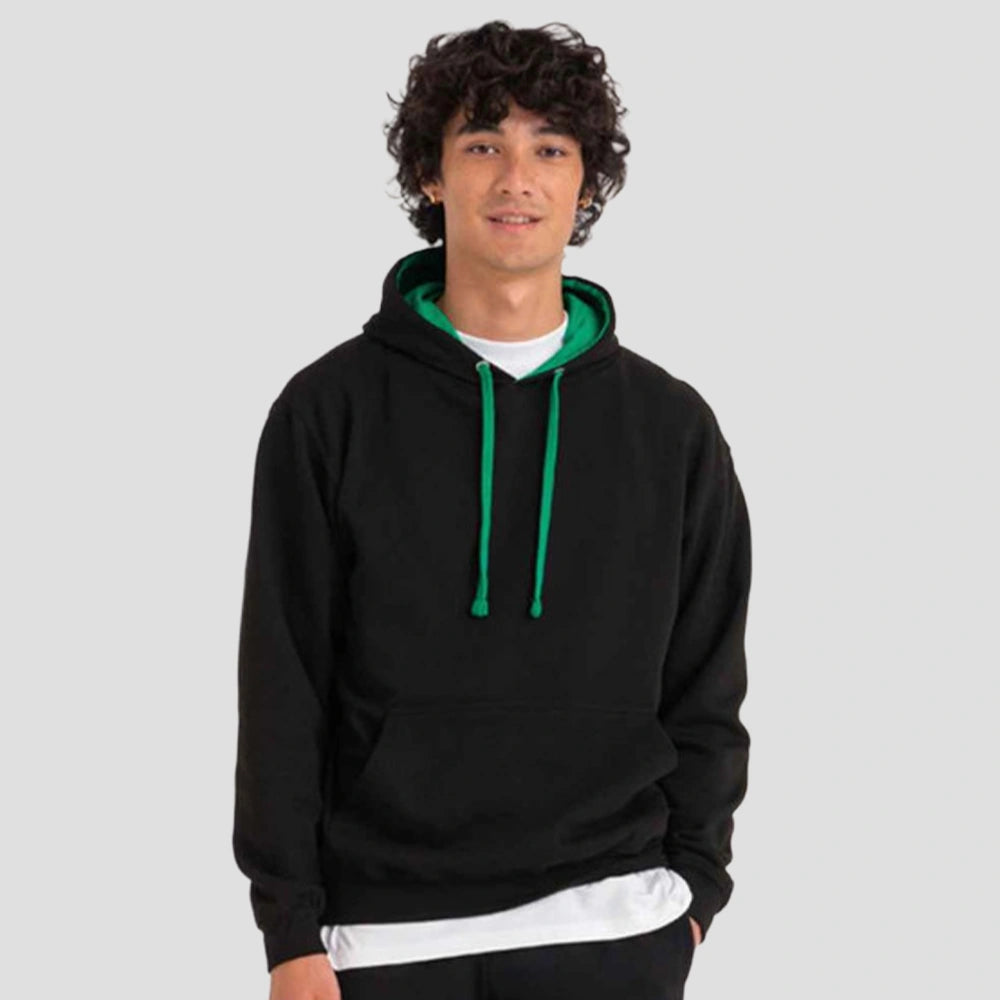 Model wearing the AWDis Varsity Hoodie JH003 in Jet Black / Kelly Green