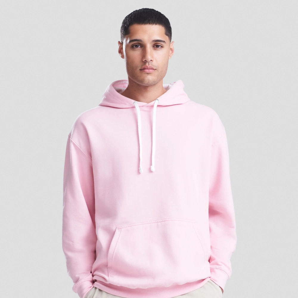 Person wearing a pink AWDis Varsity Hoodie against a plain background