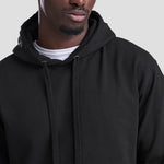 Close-up shot of Model wearing the JH011 AWDis Epic Print Hoodie in Jet Black