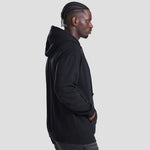 Side angle of Model wearing the AWDis Zoodie JH050 in deep black