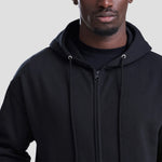 Close-up shot of model wearing the AWDis Zoodie JH050 in deep black