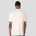 A back view of a Native Spirit Piqué Polo Shirt