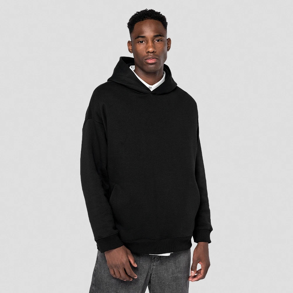 A model wearing a Native Spirit Unisex Oversized Hoodie