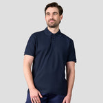 Rear view of Model wearing RX109 Pro Wicking Piqué Polo Shirt in Navy
