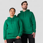 Two people wearing green Pro RTX Pro Hoodie against a plain background