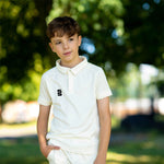 Boy wearing a Juniors Surridge Fuse Short sleeve cricket shirt