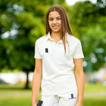 Girl wearing the Surridge cricket polo shirt and ERGO cricket pants