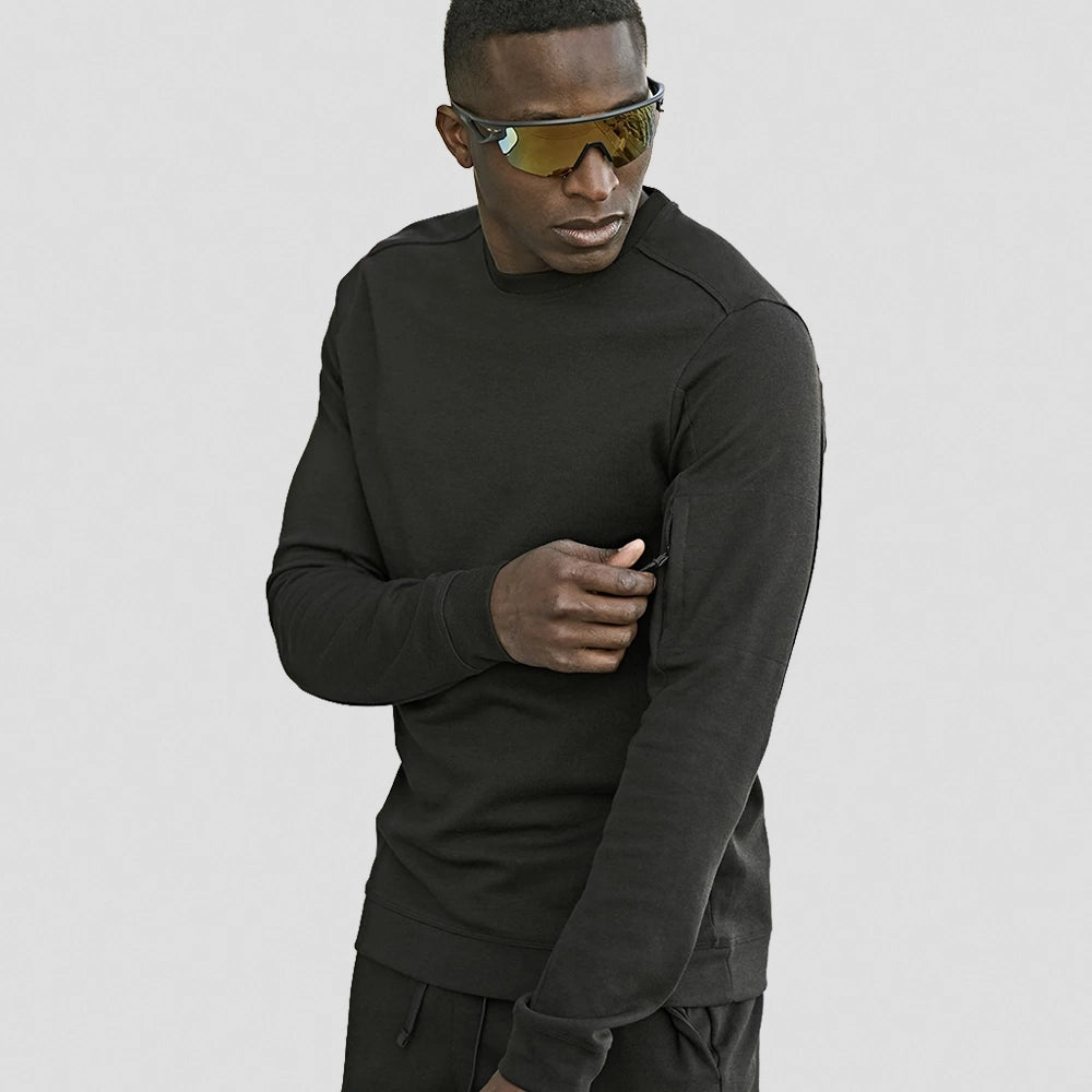 Model wearing a Tee Jays Athletic Crew Neck Sweatshirt