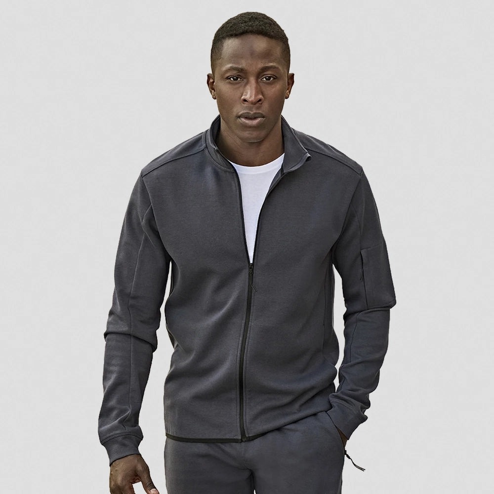 Man wearing a black Tee Jays Athletic Full Zip Sweat 