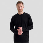 A model wearing a Uneek Long Sleeve Classic T-Shirt UC314
