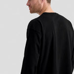A side view of a Uneek Long Sleeve Classic T-Shirt UC314