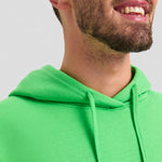 Close-up of the hood and drawstrings of a bright green Deluxe Hooded Sweatshirt UC509