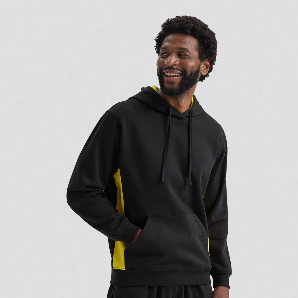 Man wearing a black Uneek Two Tone Hooded Sweatshirt UC517 with yellow accents