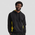 Man wearing a black Uneek Two Tone Hooded Sweatshirt UC517 with yellow accents