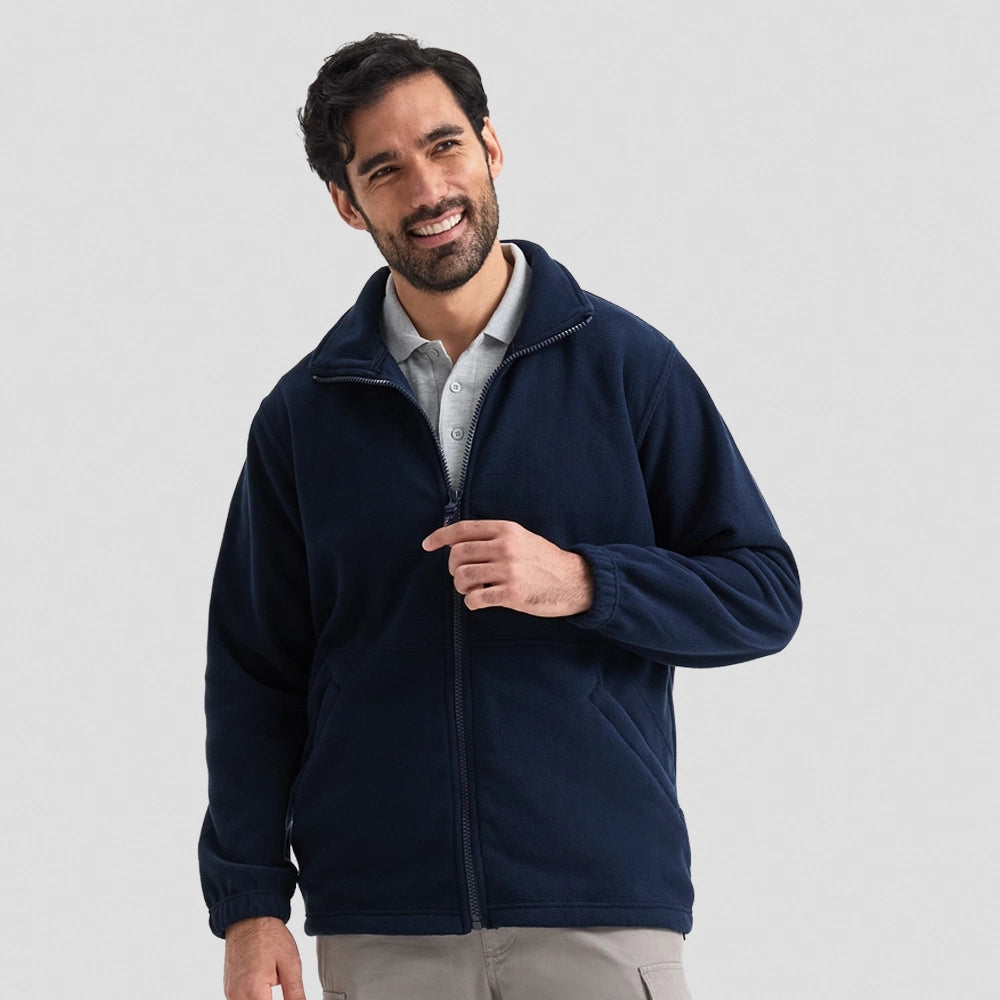 Model wearing a Uneek Heavyweight Full Zip Fleece Jacket UC601