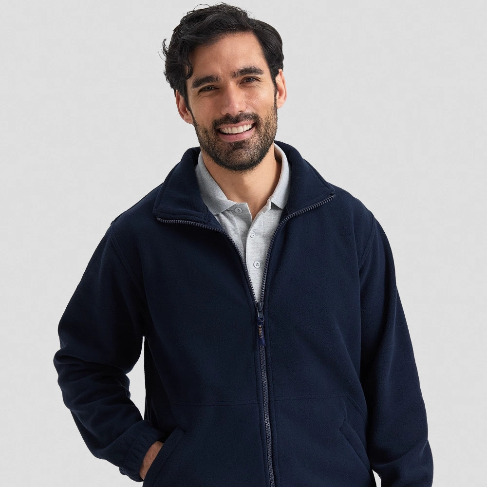 Model wearing a Uneek Heavyweight Full Zip Fleece Jacket UC601