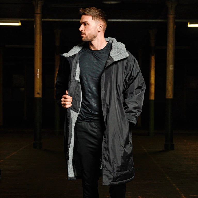 Model wearing black fleece lined changing robe
