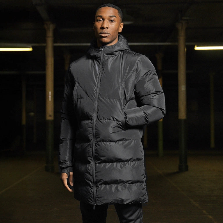 model wearing a long padded bench coat