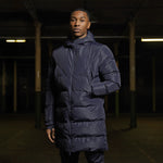 Model wearing a Navy blue Padded Bench Coat
