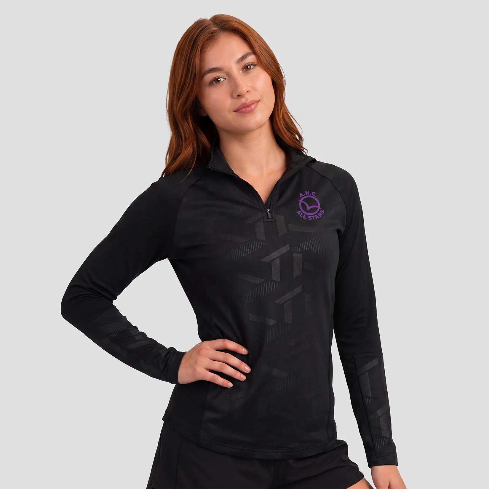 Model wearing the All Stars Netball 1/4 Zip Performance Top