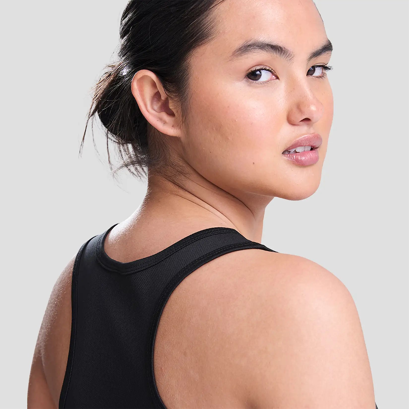 Model wearing the All Stars Netball Training Vest