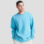Model wearing the JH030 AWDis Sweatshirt in Blue