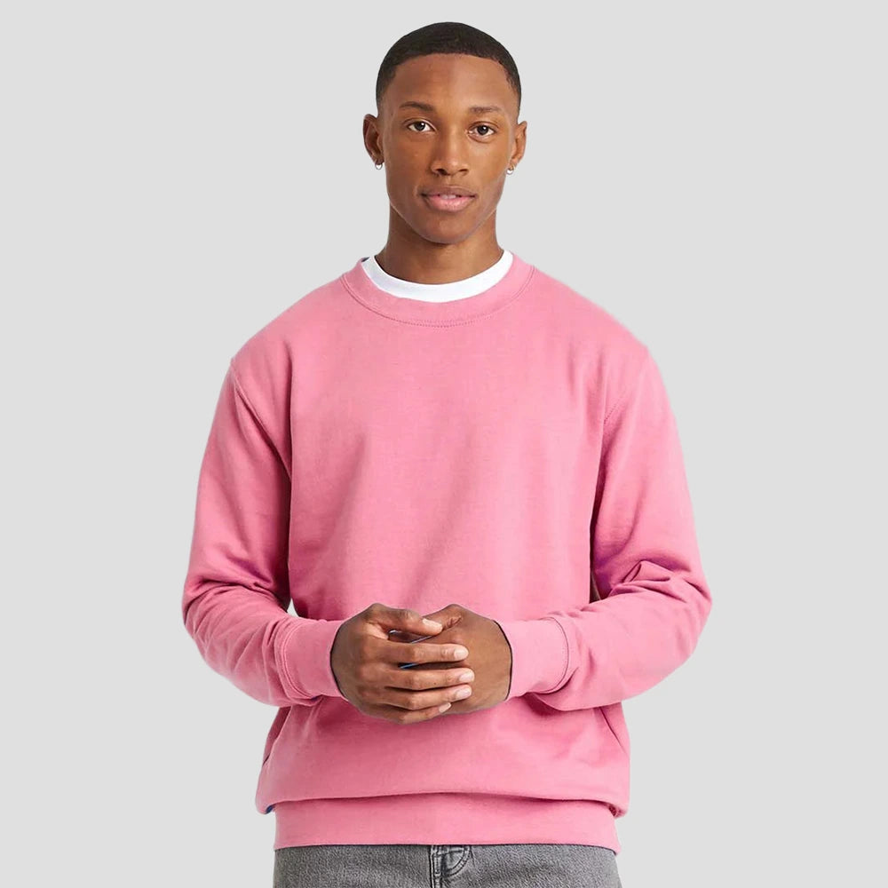 Model wearing the JH030 AWDis Sweatshirt in Candyfloss Pink