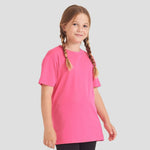 Model wearing the AWDis Kids Cool T-Shirt JC001 in Electric Pink