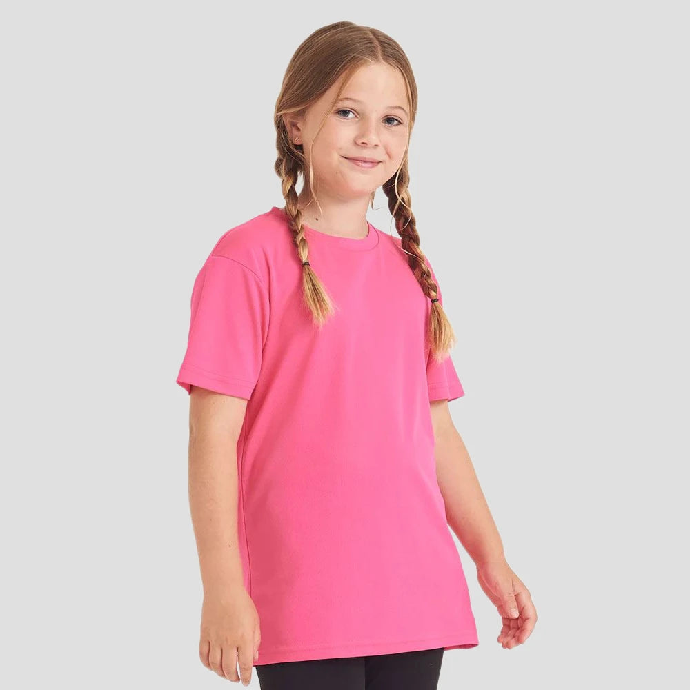 Model wearing the AWDis Kids Cool T-Shirt JC001 in Electric Pink