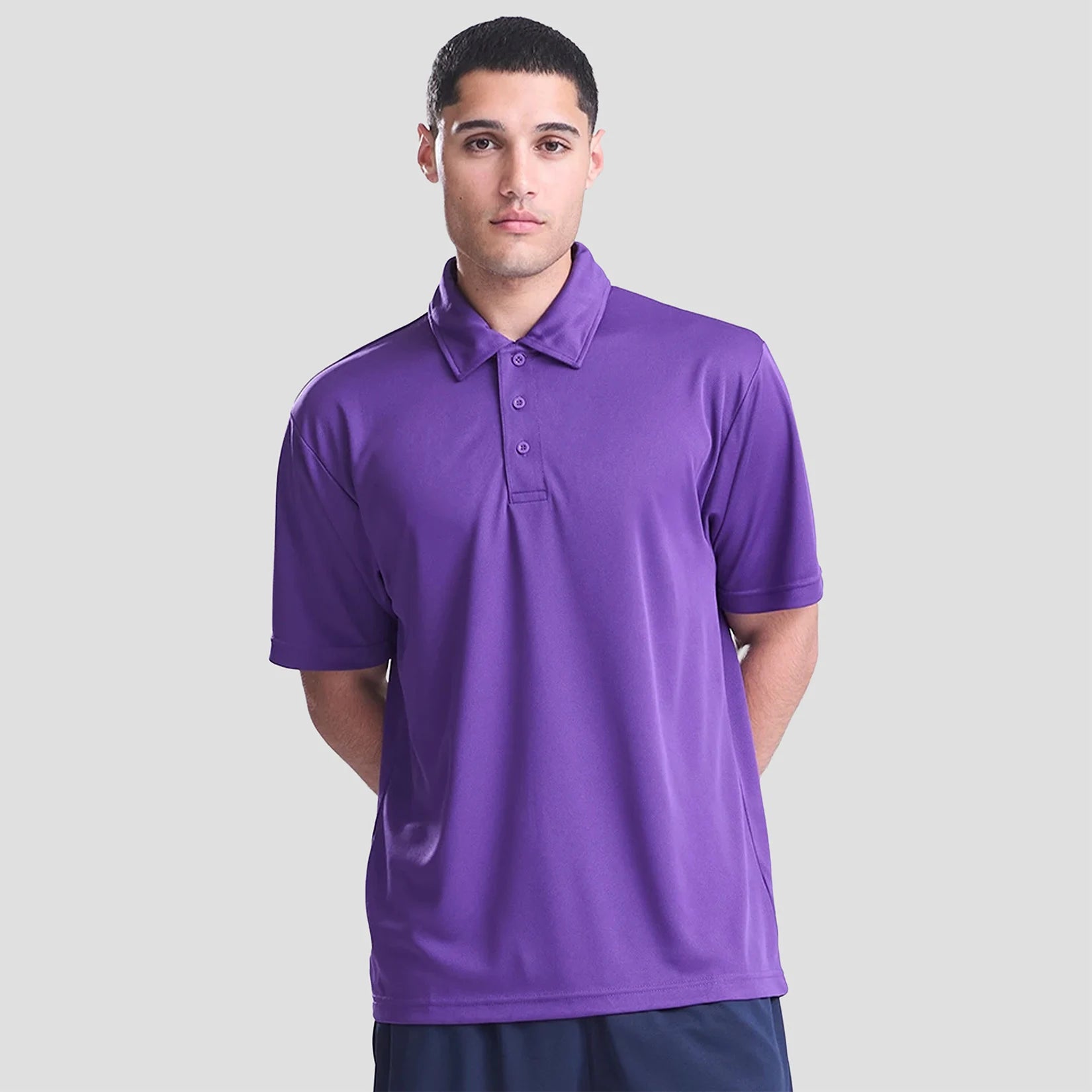 Model wearing the AWDis Cool Polo Shirt JC040