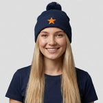 model wearing Cheshire Stars Bobble Hat