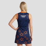Rear view of model wearing Cheshire Stars Netball Dress – Adult