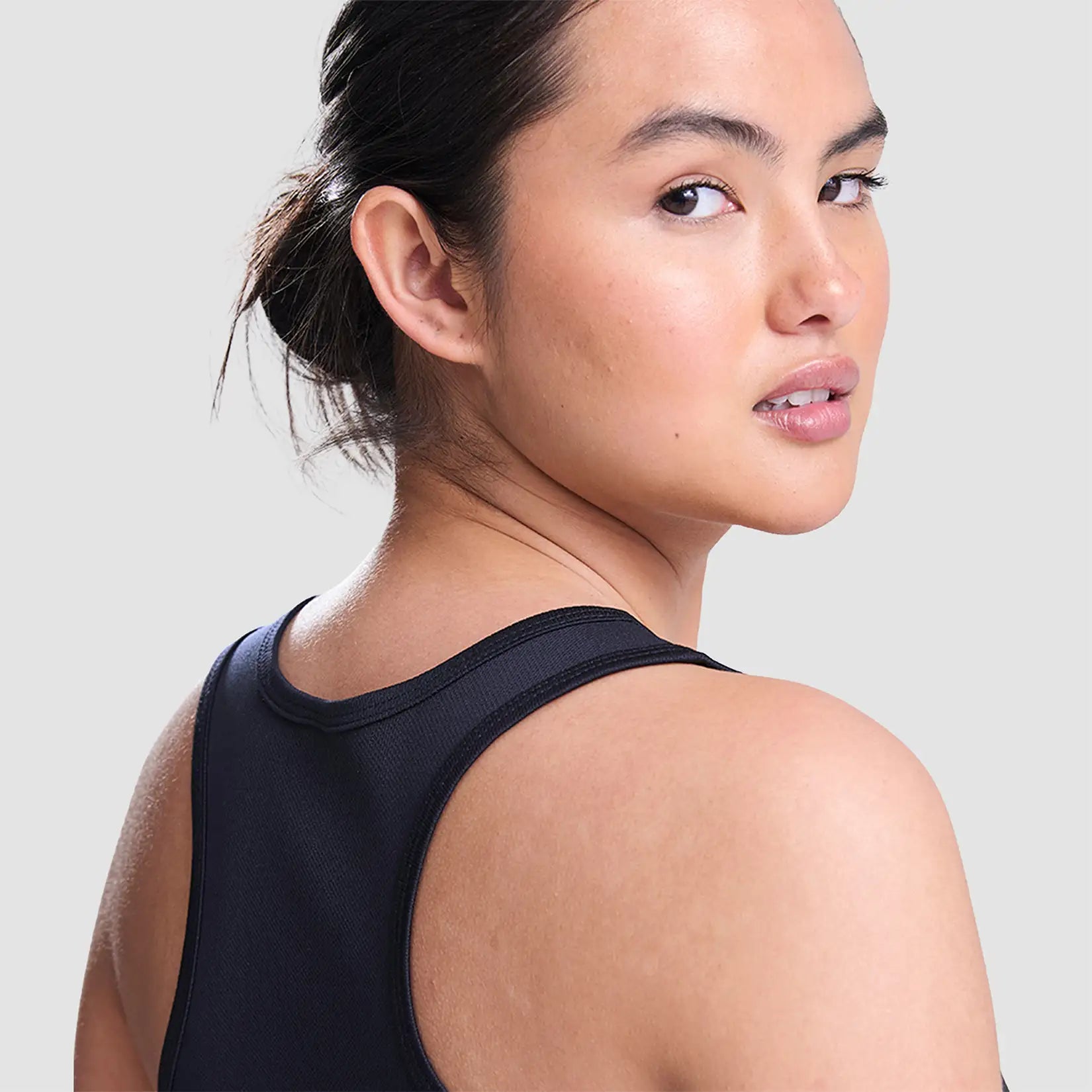 Model wearing the Cheshire Stars Netball Club Ladies Vest (Navy) - Adult
