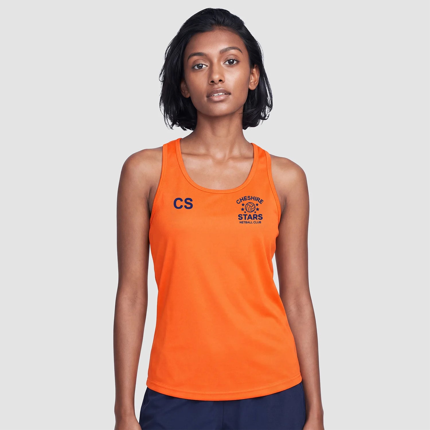 Model wearing the Cheshire Stars Netball Club Ladies Vest (Orange) - Adult
