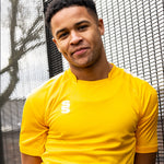 Model wearing the Stuart Surridge Dual Games Shirt in Amber